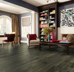 Cozy living room with elegant wood flooring, showcasing the timeless beauty and durability of wood products for home interiors.