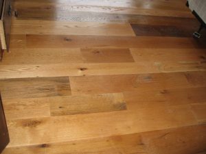 Hardwood Flooring Trends - Transformative wood floor refinishing showcasing flawless results