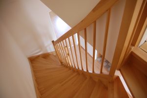 Elegant hardwood stairs showcasing well-maintained hardwood floors in a Colorado home